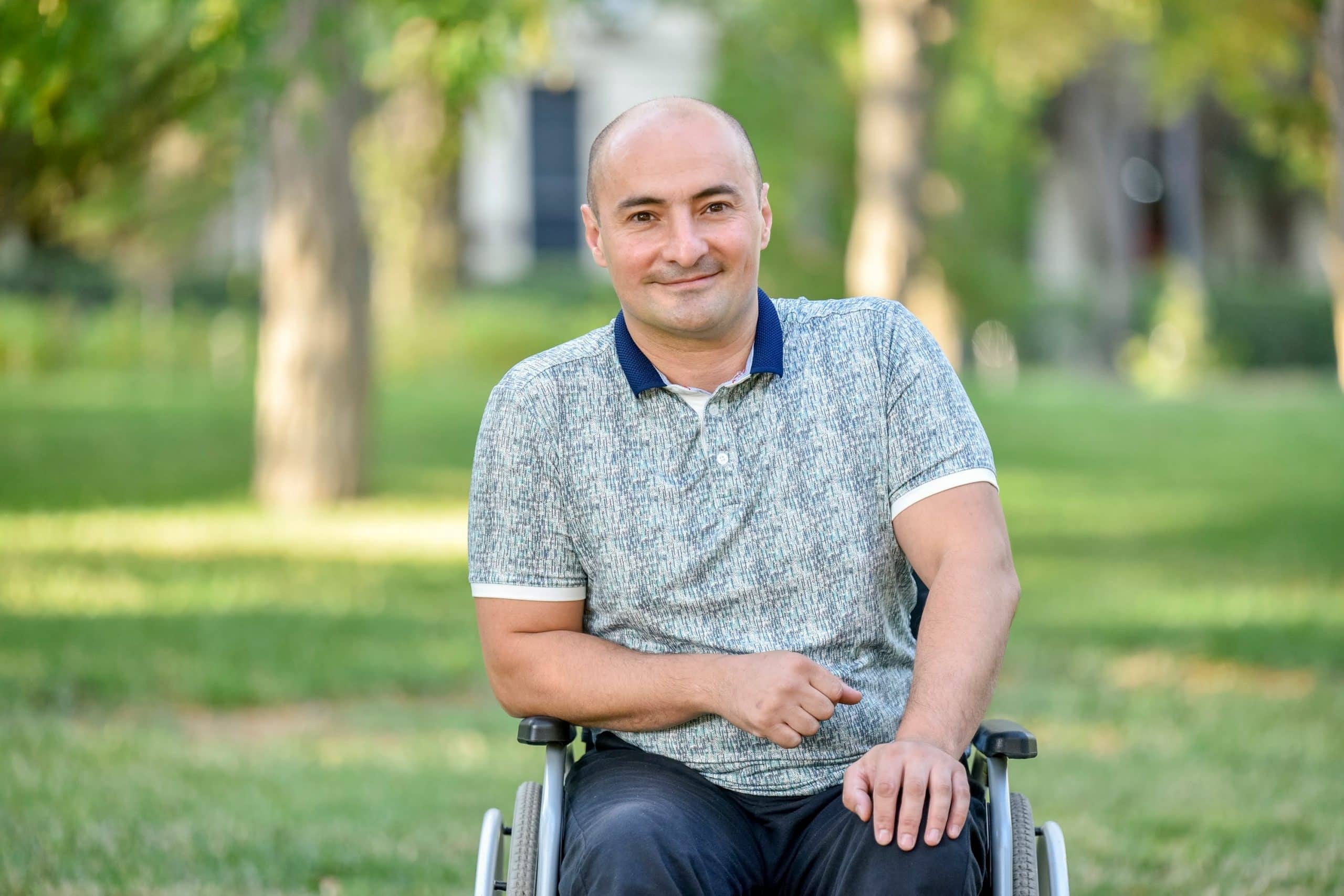 Physical Disability Counselling A man sat in his wheelchair with a laptop in front of him. He has had a accident which has resulted to him having spinal cord injury counselling